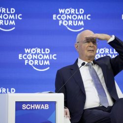 Klaus Schwab, President and founder of the World Economic Forum looks to the audience during a conversation with German Chancellor Olaf Scholz, at the World Economic Forum in Davos, Switzerland Wednesday, Jan. 18, 2023. The annual meeting of the World Economic Forum is taking place in Davos from Jan. 16 until Jan. 20, 2023. (AP Photo/Markus Schreiber),Image: 750426915, License: Rights-managed, Restrictions: This content is intended for editorial use only. For other uses, additional clearances may be required., Model Release: no, Credit line: ČTK / AP / Markus Schreiber